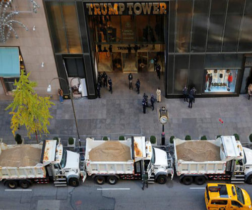 Sanitation trucks filled with sand act as barricades along Fifth Avenue outside Republican presidential nominee Donald Trump's Trump Tower in Manhattan, New York, U.S., November 8, 2016. REUTERS/Andrew Kelly